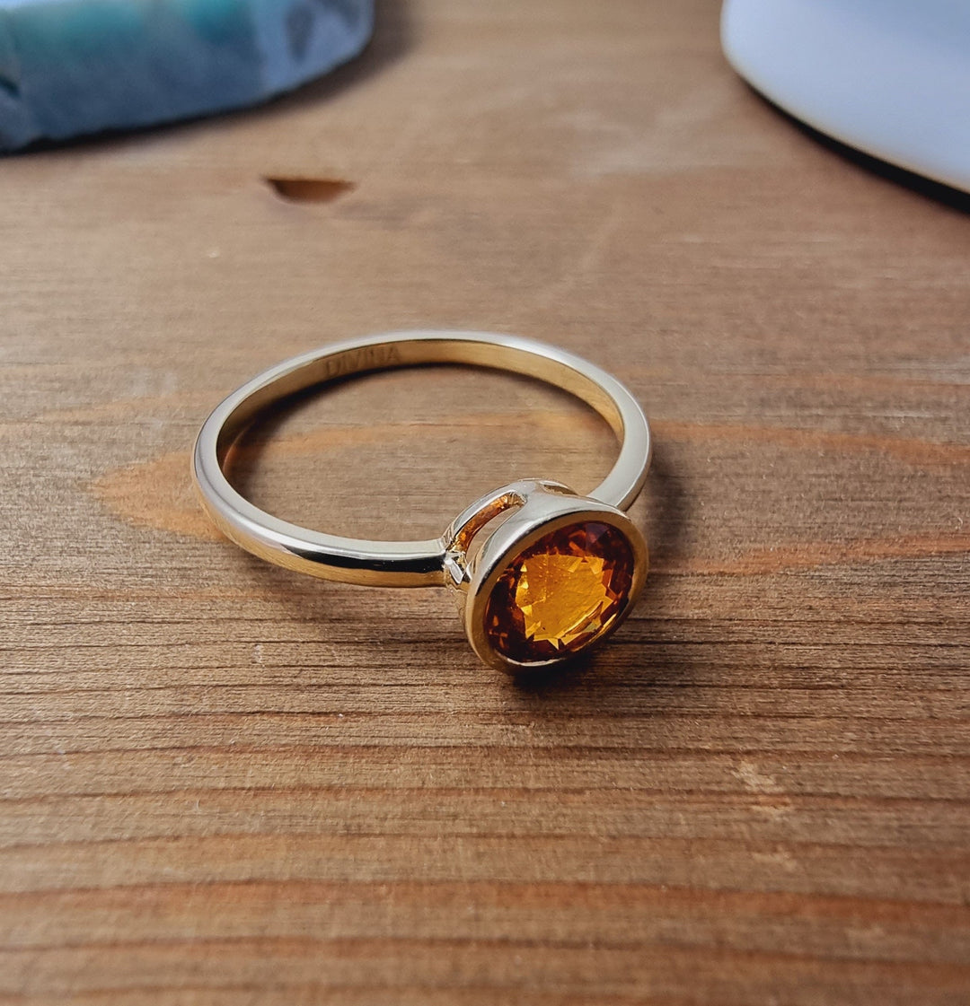 Solitaire Orange Sapphire Ring in Bezel Setting made of 14K Yellow Gold 1.22 TCW
