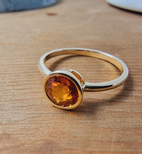 Load image into Gallery viewer, Solitaire Orange Sapphire Ring in Bezel Setting made of 14K Yellow Gold 1.22 TCW
